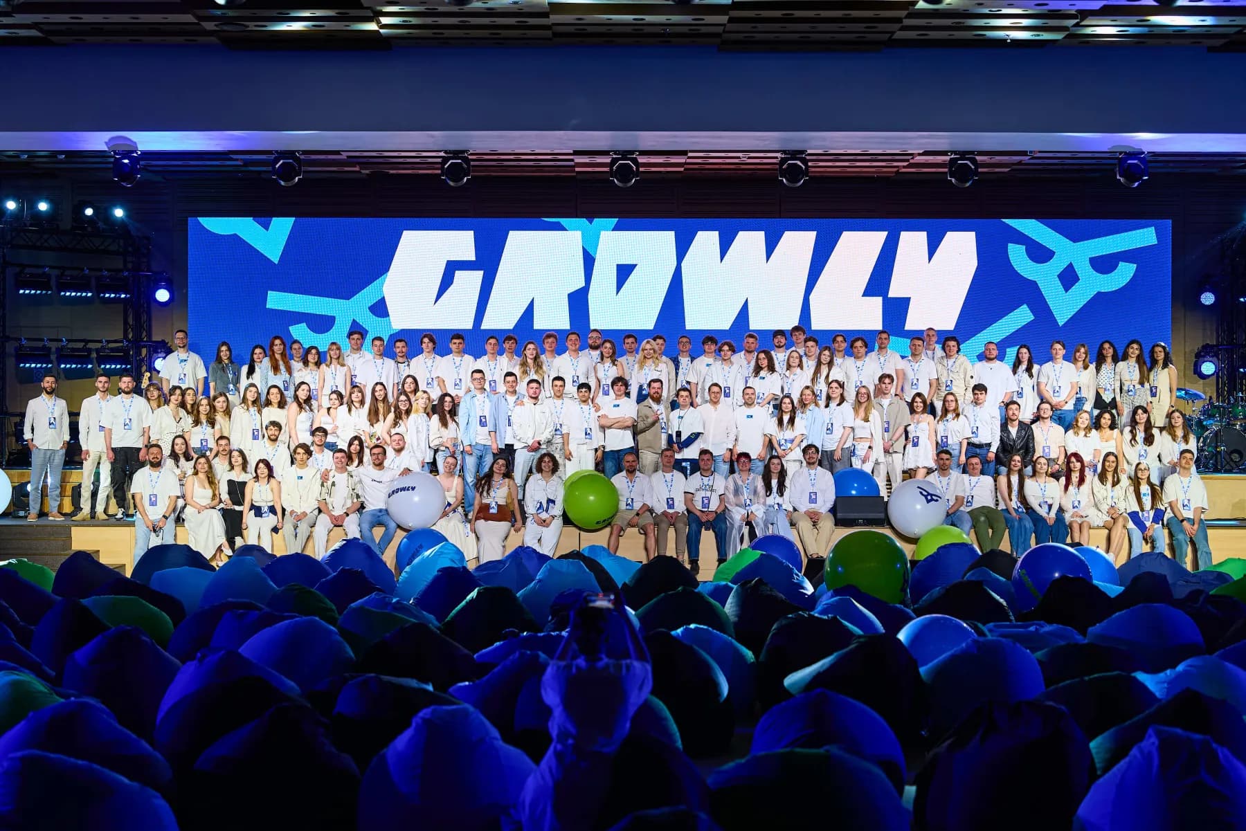 The whole Growly team on stage at a company all-hands — more than 100 people